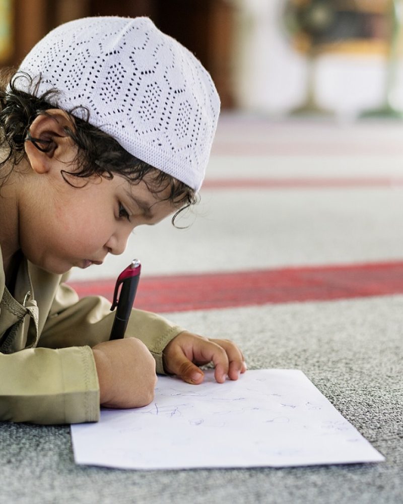 Muslim boy learning in a mosque